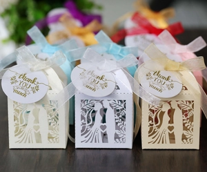 Laser-cut wedding favor boxes with groom bride silhouette and thank you heart tag