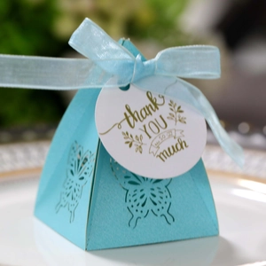 Close-up of sky blue butterfly cutout candy box with Thank You tag and ribbon