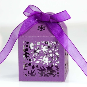 Elegant purple hollow gift box with snowflake cutout design and matching silk ribbon bow