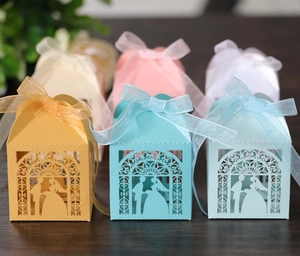 Detailed laser-cut wedding candy box with arch silhouette and ribbon bow tie