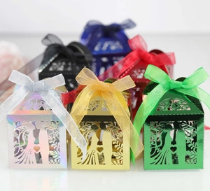 Laser-cut wedding favor boxes in multiple colors with bride and groom silhouette design
