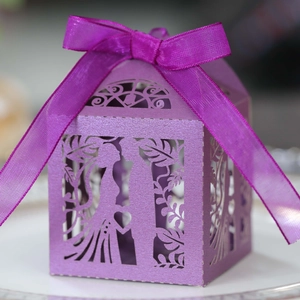 Detailed laser-cut lavender gift box with hollow heart design and silk ribbon