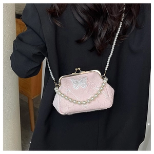 Pink crossbody bag with silver butterfly embroidery and elegant pearl chain strap detail