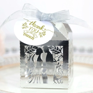 Silver laser cut wedding favor box with bride groom silhouette and grey organza ribbon