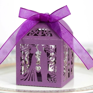 Detailed laser-cut purple wedding candy box with silhouette and satin ribbon