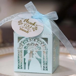Detailed laser-cut light blue wedding candy box with couple silhouette and thank you tag