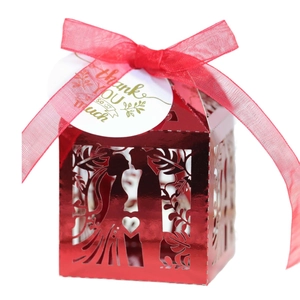 Red hollow-out heart wedding favor box with gold thank you card and silk ribbon
