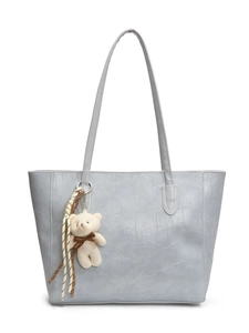 Light blue faux crocodile tote bag for women with cute white teddy bear charm and long straps