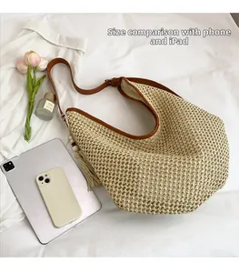 Macro shot of French woven straw tote featuring leather handles and tassel detail