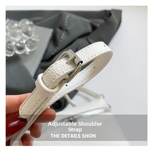 Detail view of adjustable white pebble leather strap with high-quality metal buckle