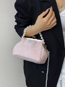 Pink pearl strap handbag with lace butterfly detail and vintage metal clasp design