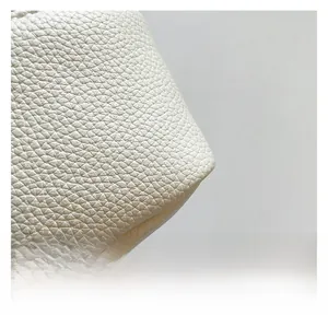 Close-up of white lychee pattern leather texture with high-quality grain details