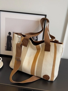 Large striped canvas tote bag with adjustable shoulder strap for casual daily use