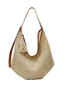 Large straw tote bag with brown faux leather straps and fringe for summer beach travel