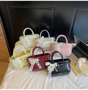 Collection of glossy wrinkled leather tote bags with pearl heart charms in six colors