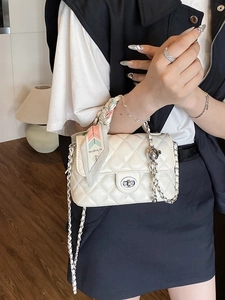 Chic beige quilted square chain bag with elegant printed scarf handle and silver accents