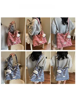 Macro details of striped canvas tote bags in red and blue with cloud plush charm