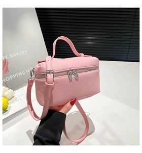 Pink lychee grain leather mini vanity case bag with silver hardware and adjustable strap