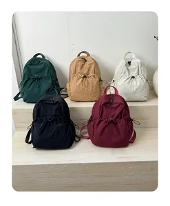 Nylon drawstring backpacks in olive, khaki, beige, black, and wine red with pleated texture