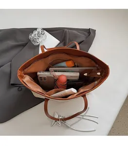 Top view of woven tote bag showing large capacity for tablet, umbrella and essentials