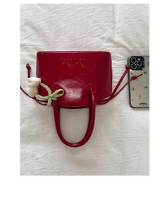 Mini red glossy patent leather bucket bag with floral tulip charm and ribbon detail
