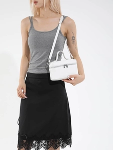 Minimalist white rectangular handbag with top handle and silver zipper on white backdrop