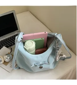 Internal view of a light blue handbag showing large capacity for tablets and daily items