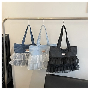 Detailed comparison of denim tote bags in dark blue, light blue and black with lace trim