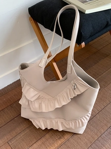 Creamy beige tote bag featuring triple-layered lace ruffles and slim shoulder straps