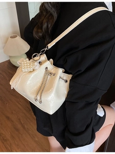 Fashionable cream white ruched bucket bag with pearl heart pendant and drawstring