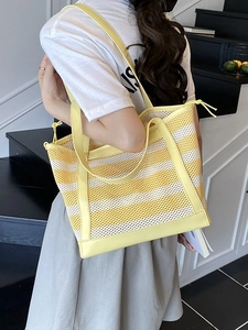 Summer yellow and white striped mesh tote bag with leather handles and drawstring closure