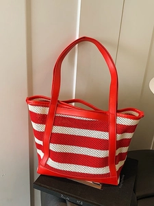 Red and white striped woven tote bag with leather handles for summer beach and commute