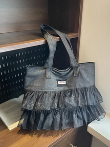Dark grey denim tote bag with layered black organza lace trim and fashion label
