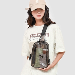 Close-up of clear PVC crossbody bag showing internal storage for phone and wallet