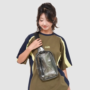 Detail of transparent PVC chest bag with black trim and adjustable textile shoulder strap