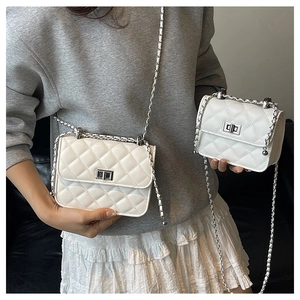 Comparison of small and large white quilted crossbody bags with chain straps