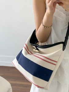Large striped canvas tote bag with wooden horn buckle and black leather shoulder straps