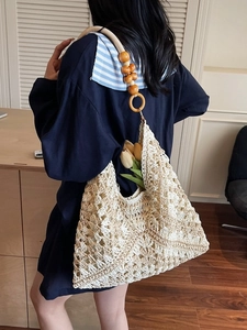 Bohemian crochet tote bag with geometric hollow patterns and wooden beaded straps