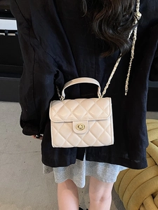 Quilted diamond lattice shoulder bag in cream white with gold chain and turn-lock