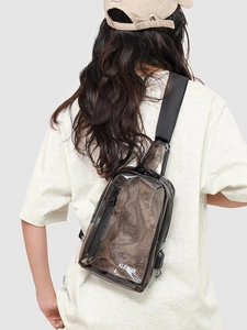 Transparent PVC chest bag with black strap and white KLEIMAN logo shown on model back