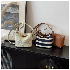 Detail of woven raffia shoulder bags and leather pouch for summer beach fashion