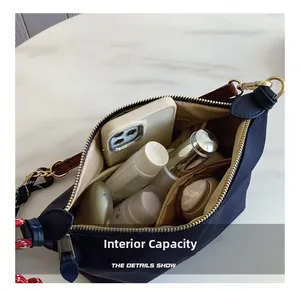 Detailed view of the canvas bag's interior storage space and compartment layout