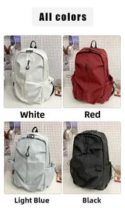 Detail view of four casual backpacks in white, red, light blue, and black colors