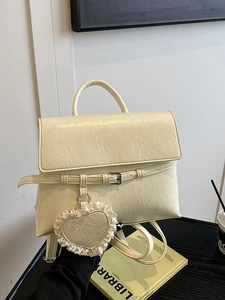 Chic off-white faux leather backpack with lace heart charm and elegant buckle flap