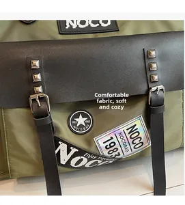 Detail of army green nylon travel bag with rivets and embroidery patch embroidery