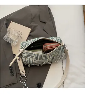 Detail of green and white striped tote interior showing large capacity for essentials