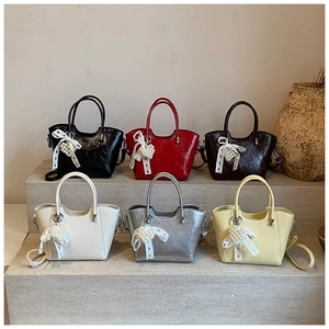 Collection of stylish bucket bags in six colors with pearl heart charms and lace bows