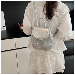 Silver PU leather mini backpack with metal chain and LOVE FREEDOM LIFE print detail