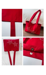 Detail view of red canvas tote with silver star rivets and magnetic snap closure