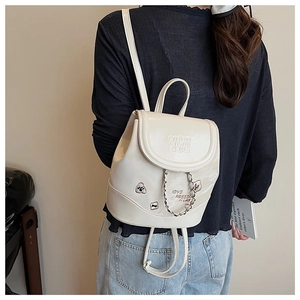Detail of off-white leather backpack featuring silver chain and embossed logo design